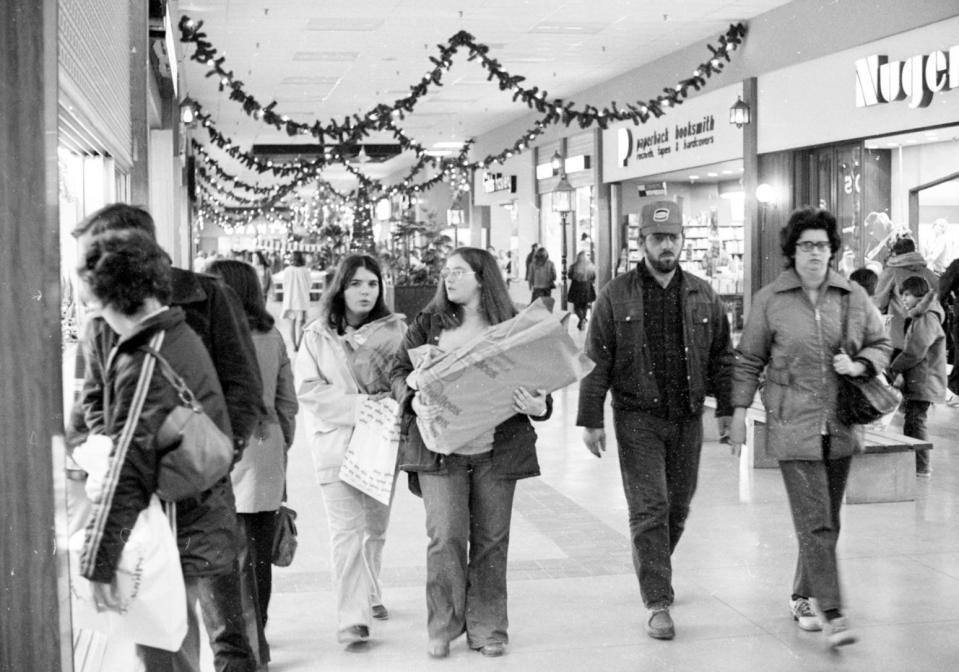 Christmas shoppers at the Harbour Mall in Fall River in the early 1970s. Visible in the background are stores like Fields Hosiery, Paperback Booksmith, and Grant City, the anchor location where Kmart eventually moved in.