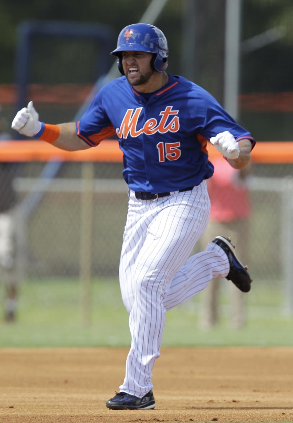 <p>Tim Tebow reacts after hitting a solo home run in his first at bat during the first inning of his first instructional league baseball game for the New York Mets against the St. Louis Cardinals instructional club Wednesday, Sept. 28, 2016, in Port St. Lucie, Fla. (AP Photo/Luis M. Alvarez) </p>