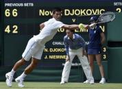 Novak Djokovic of Serbia hits a shot during his match against Jarkko Nieminen of Finland at the Wimbledon Tennis Championships in London, July 1, 2015. REUTERS/Toby Melville