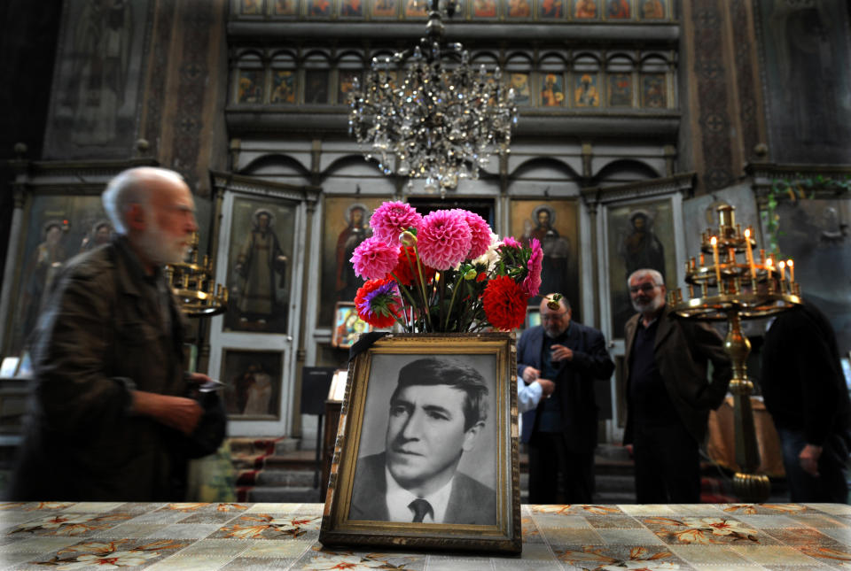 People attend a commemoration service marking 35 years of the dead of Georgi Markov, a bulgarian disident killed in London in 1978, in a church in Sofia on September 11, 2013. Bulgaria is set to close a 35-year probe into the spectacular