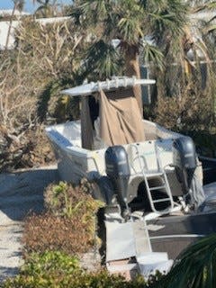 This boat is in a Sanibel driveway, not the canal where it belongs.