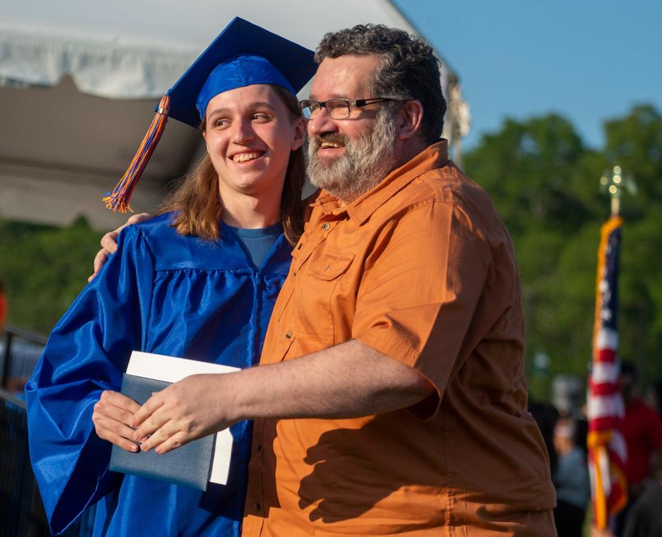 Keefe Tech Spanish teacher Marcio Sabo poses for a picture with his son, new graduate Samuel Sabo, May 31, 2023.