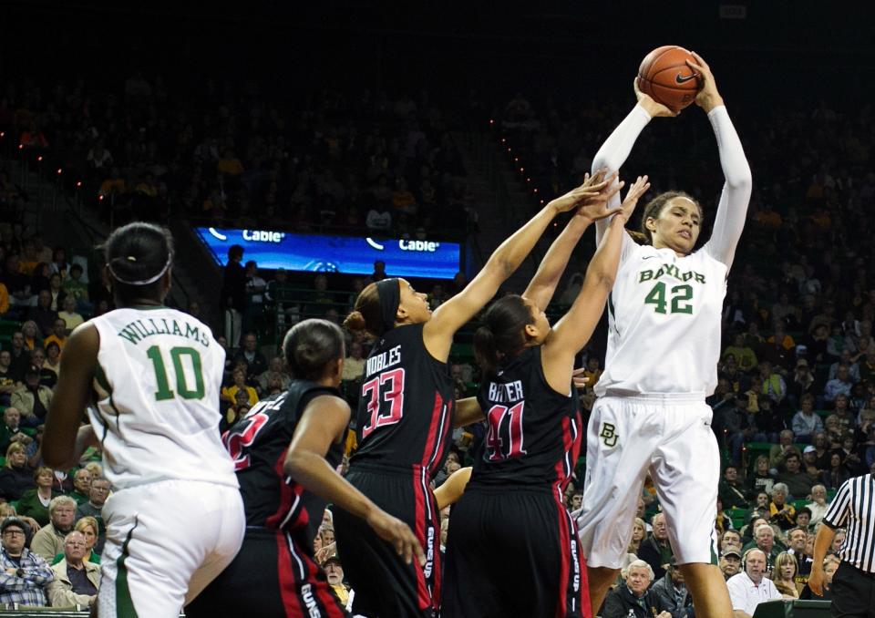 Baylor center Brittney Griner (42) grabs a rebound over Texas Tech forward Kelsi Baker (41) during the first half at the Ferrell Center, Tuesday, Feb. 12, 2013, in Waco, Texas.