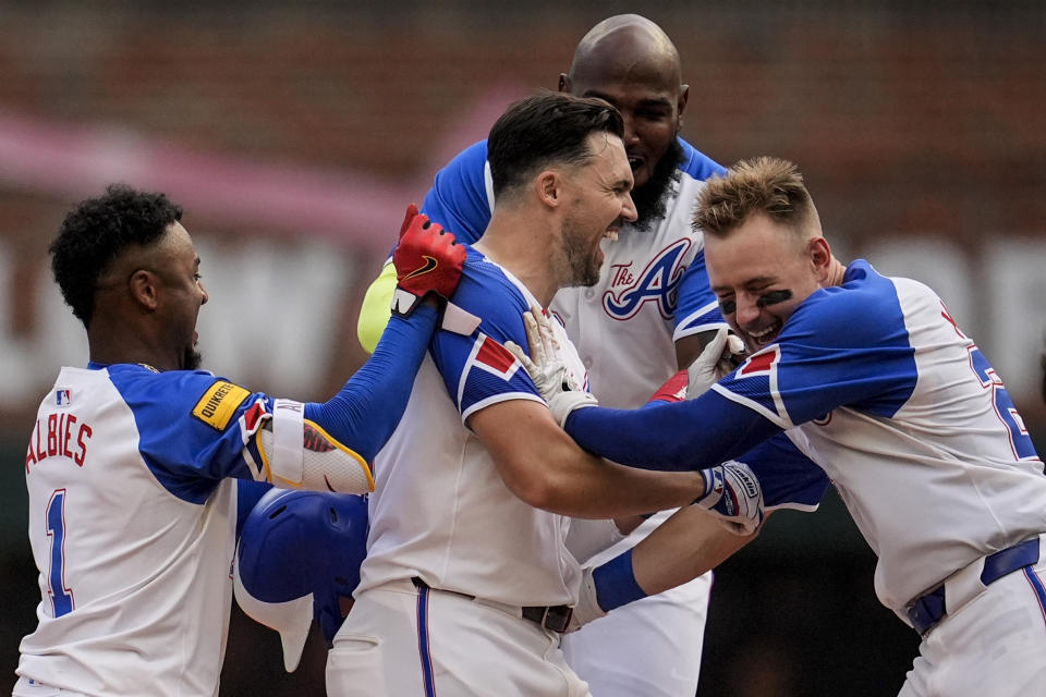 Atlanta Braves outfielder Adam Duvall (14) celebrates his game-winning RBI against the Pittsburgh Pirates in the 10th inning of a baseball game, Saturday, June 29, 2024, in Atlanta. (AP Photo/Mike Stewart)