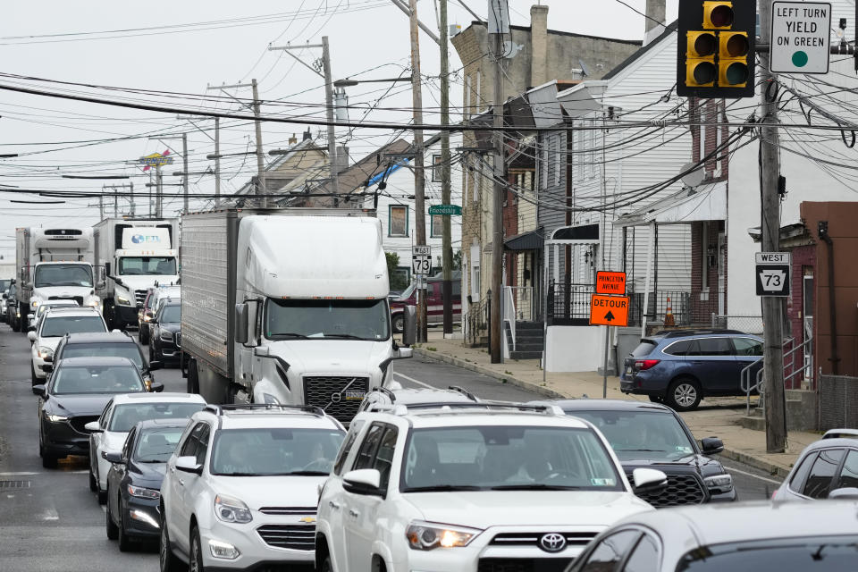 Traffic creeps along on a detour in Philadelphia, Monday, June 12, 2023. Drivers began longer commutes Monday after a section of I-95 collapsed a day earlier following damage caused by a tanker truck carrying flammable cargo catching fire. (AP Photo/Matt Rourke)
