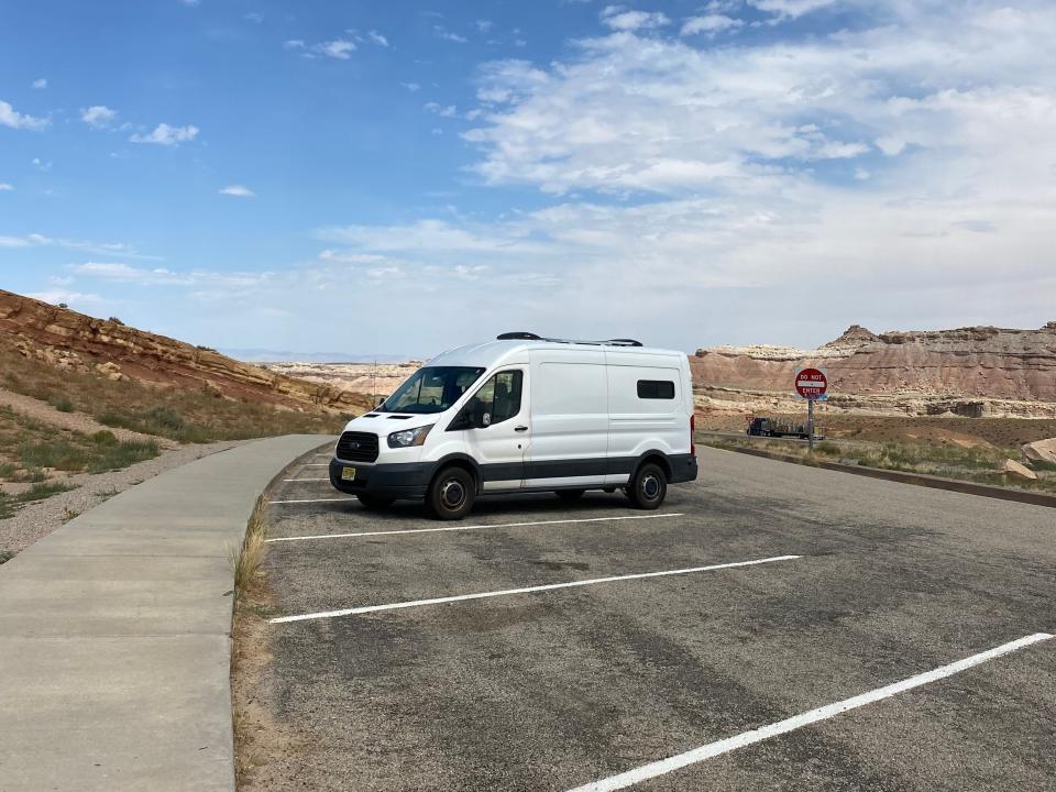 The exterior of the van on the road.