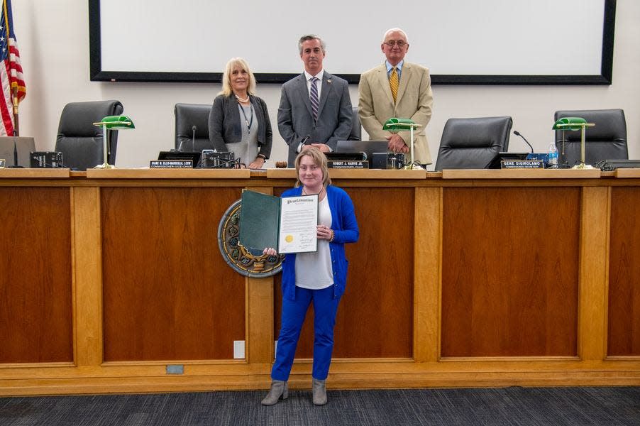 Middletown Supervisor Chairperson Anna Payne holds the Bucks County Proclamation of March as Colorectal Cancer Awareness Month after county Commissioners Diane Ellis-Marseglia, Bob Harvie and Gene DiGirolamo (right) thanked her for speaking out about her condition.