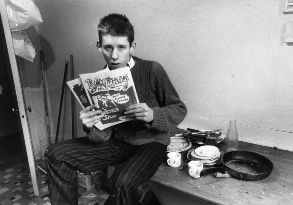 Shane MacGowan, then 19 years old, holds up a copy of his punk rock magazine Bondage in London in an undated photo.