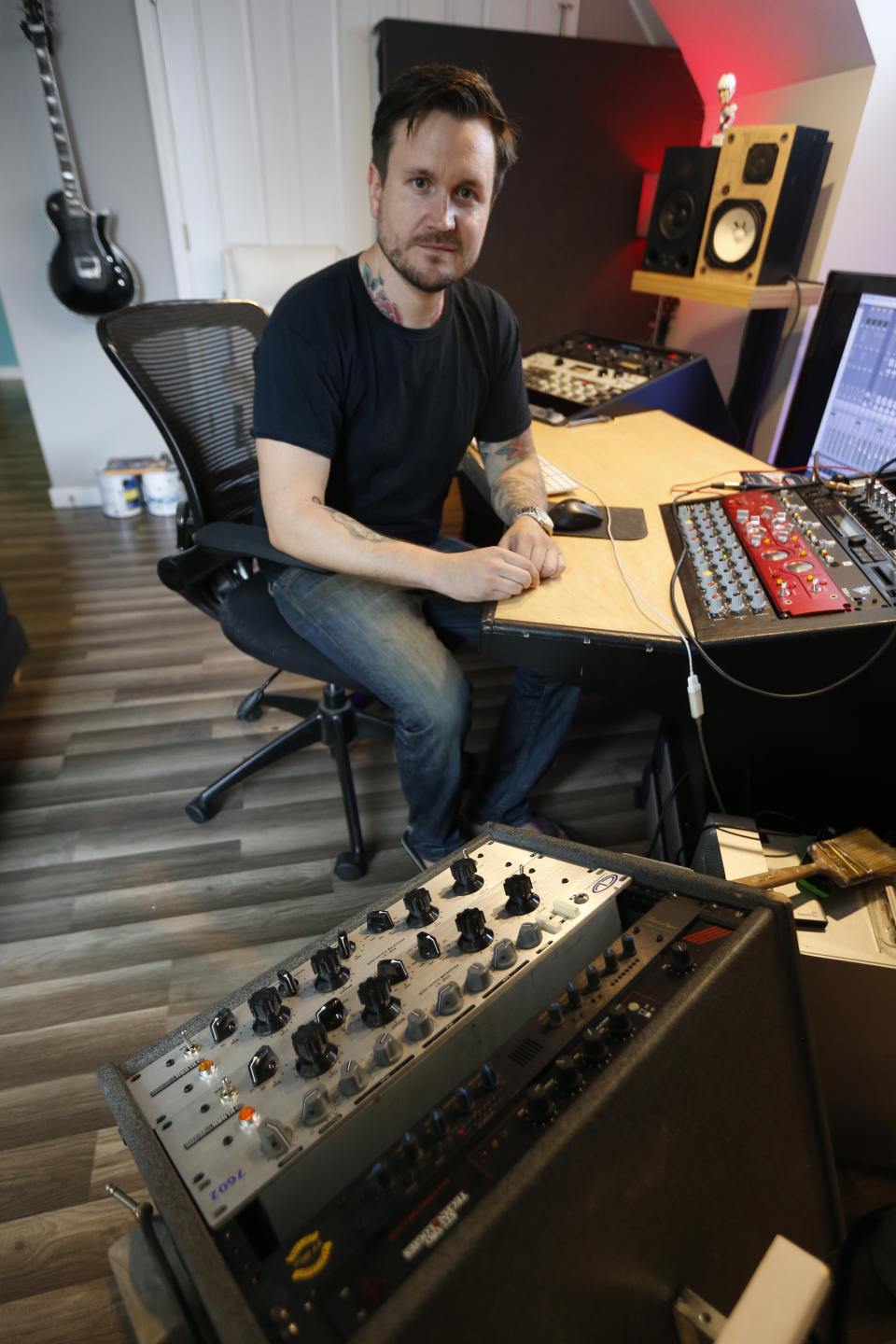 In this Sept. 30, 2019 photo, Andreas Magnusson, a music producer who has been in the US for over 30 years, poses in his studio in Richmond, Va. Magnusson is among the oldest immigrants enrolled in Deferred Action for Childhood Arrivals, known as DACA. He came to the U.S. from Sweden when he was a toddler. His mother had a student visa and eventually found an employer who was sponsoring the two, but an immigration lawyer botched their case, and Magnusson, already an adult with a growing business, a home and a car, was left without legal status. (AP Photo/Steve Helber)