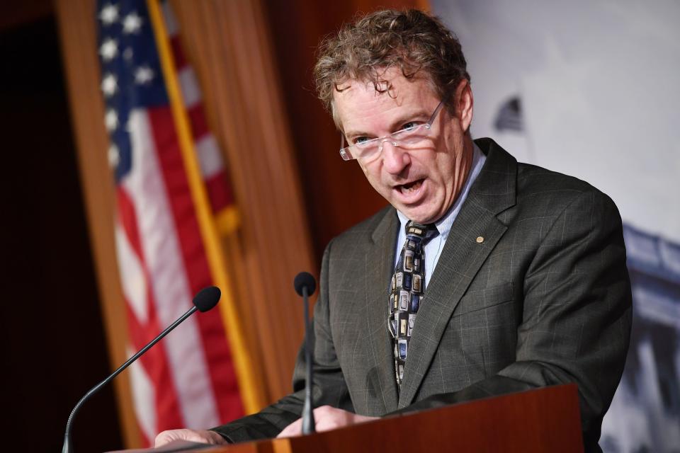 Sen. Rand Paul (R-Ky.) reads the "whistleblower" question blocked by Supreme Court Chief Justice John Roberts during the impeachment trial proceedings of President Donald Trump on Capitol Hill Jan. 30. (Photo: MANDEL NGAN via Getty Images)