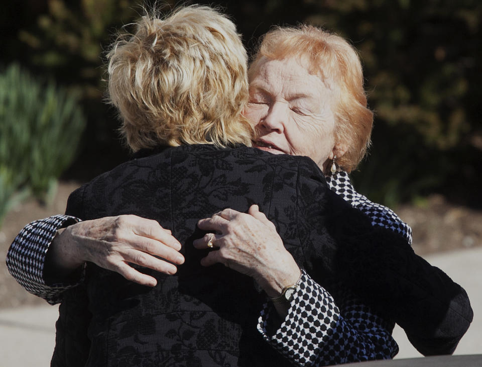 Rosemarie Colvin, right, mother of Marie Colvin, is embraced by a mourner as they arrive for the funeral service for journalist Colvin, Monday, March 12, 2012 at St. Dominic Roman Catholic Church in Oyster Bay, N.Y. The 56-year-old Colvin was a longtime reporter for Britain's Sunday Times. She and French photographer Remi Ochlik were killed Feb. 22 in shelling in Homs, Syria. (AP Photo/Mark Lennihan)