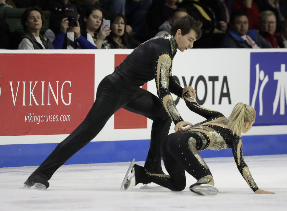 Alexa Scimeca Knierim takes a fall as she performs with Chris Knierim during the pairs short program at Skate America, Friday, Oct. 19, 2018, in Everett, Wash. (AP Photo/Ted S. Warren)