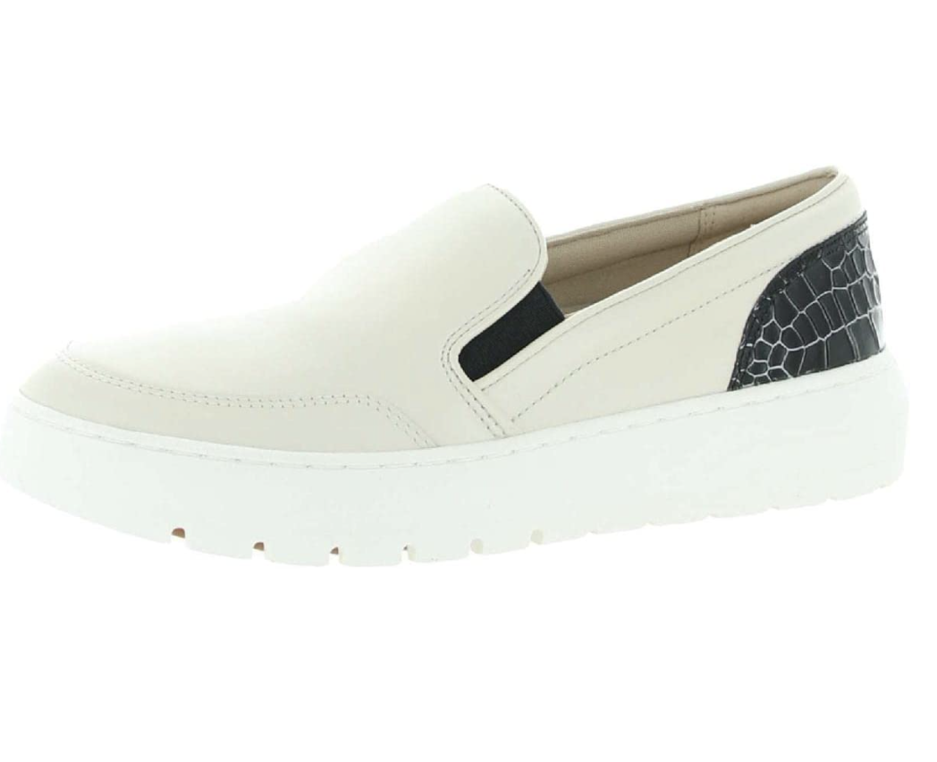 White slip-on shoe with black croc detail.