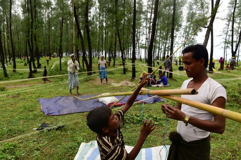 Rohingya Muslim refugees build temporary, makeshift shelters, after crossing the border from Myanmar, in the Bangladeshi town of Teknaf on September 10, 2017