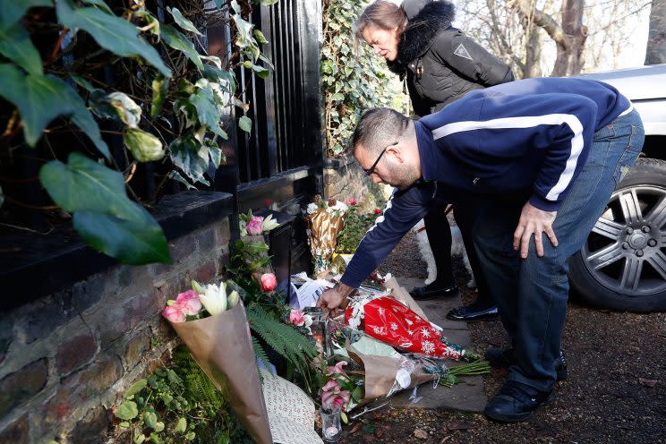 Fans leave tributes outside the home of British musician George Michael in London, Monday, Dec. 26, 2016. (AP Photo/Kirsty Wigglesworth)