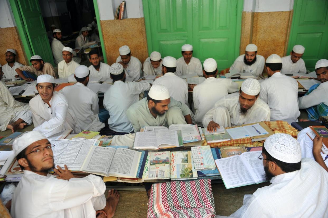<span class="caption">Students on the campus of Darul Uloom, the Deoband school of Islam located in a small town, Deoband, in the northern Indian state of Uttar Pradesh</span> <span class="attribution"><a class="link " href="https://www.gettyimages.com/detail/news-photo/in-this-picture-taken-on-september-7-2011-muslim-students-news-photo/128403818?adppopup=true" rel="nofollow noopener" target="_blank" data-ylk="slk:Sajjad Hussain/AFP via Getty Images;elm:context_link;itc:0;sec:content-canvas">Sajjad Hussain/AFP via Getty Images</a></span>
