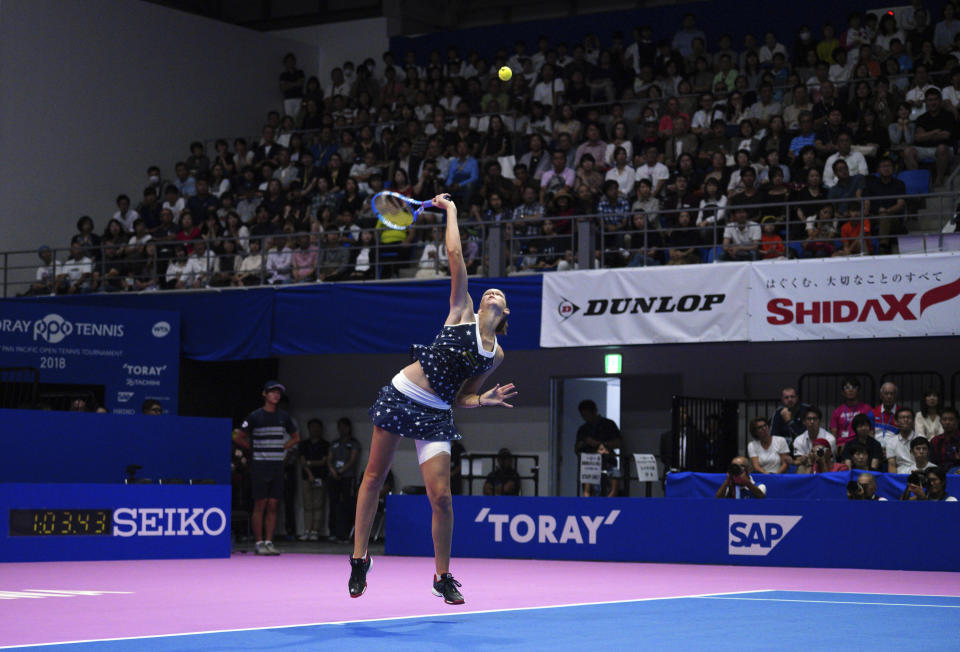 Karolina Pliskova, of Czech Republic serves a ball against Naomi Osaka, of Japan during the final match of the Pan Pacific Open women's tennis tournament in Tokyo Sunday, Sept. 23, 2018. (AP Photo/Eugene Hoshiko)