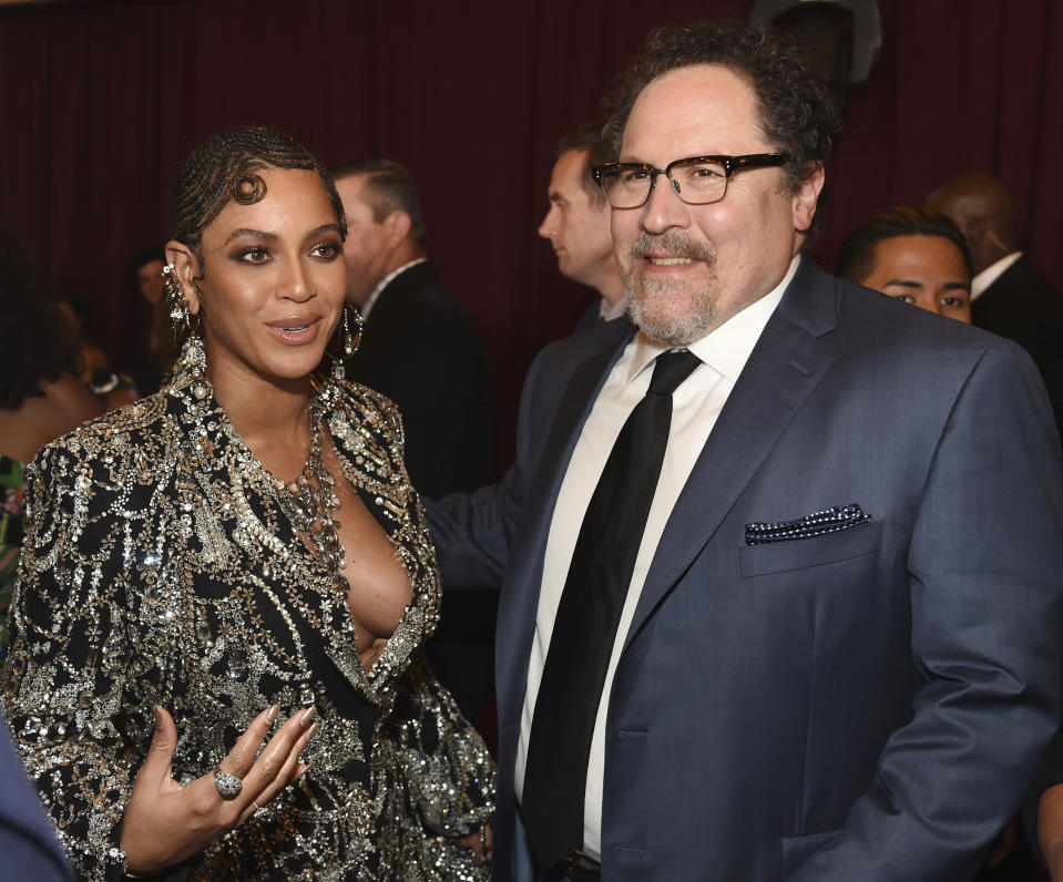 Beyonce, left, a cast member in "The Lion King," and the film's director Jon Favreau pose together at the premiere of the film, Tuesday, July 9, 2019, in Los Angeles. (Photo by Chris Pizzello/Invision/AP)