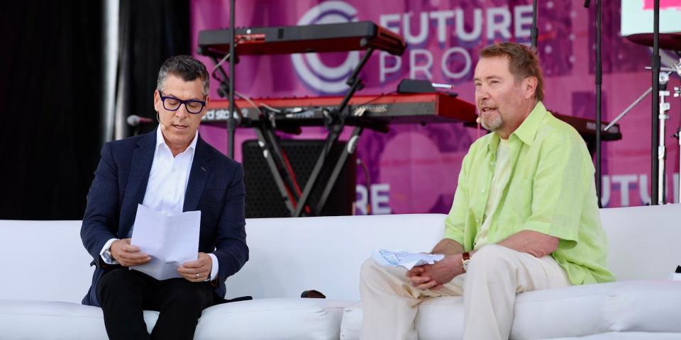 Jeffrey Gundlach, wearing a lime green shirt and tan pants, speaks at the Future Proof festival in Huntington Beach, California