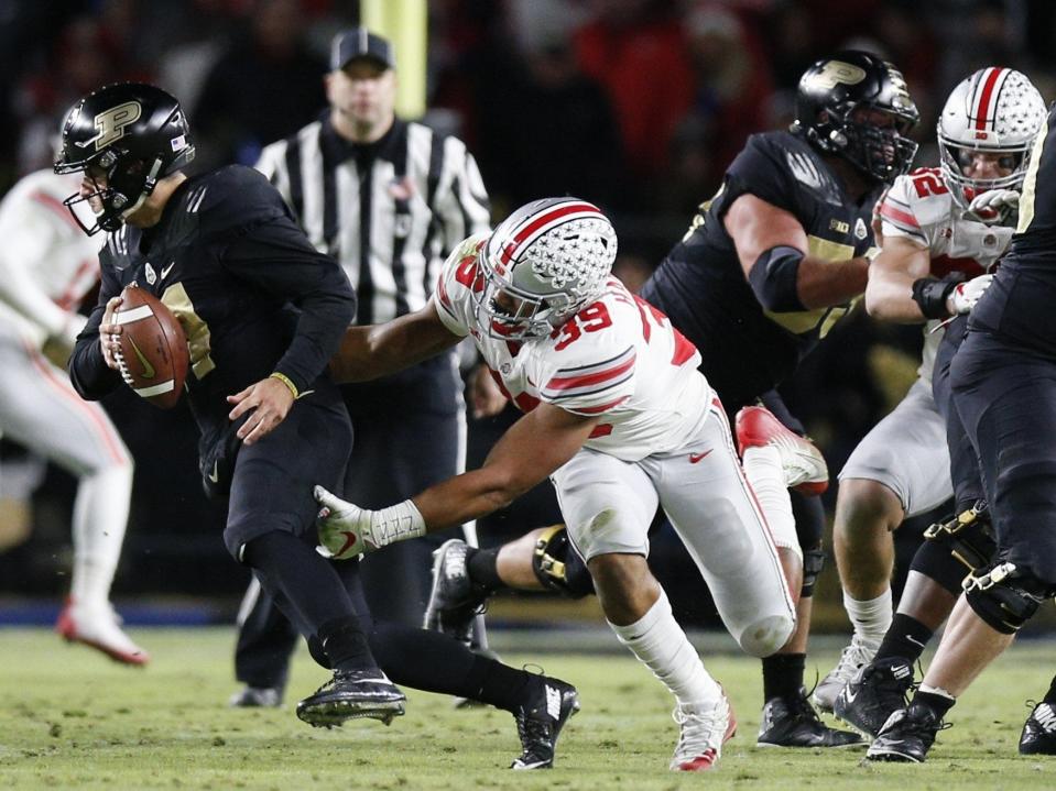 Ohio State Buckeyes linebacker Malik Harrison (39) pressures Purdue Boilermakers quarterback David Blough (11) during the first quarter of a NCAA college football game between the Purdue Boilermakers and the Ohio State Buckeyes on Saturday, October 20, 2018 at Ross-Ade Stadium in West Lafayette, Indiana. [Joshua A. Bickel/Dispatch]