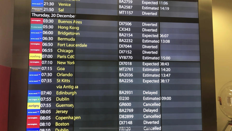 The arrivals board at Gatwick Airport showing cancelled, diverted and delayed flights as the airport remains closed with incoming flights delayed or diverted to other airports, after drones were spotted over the airfield last night and this morning Thursday Dec. 20, 2018. London's Gatwick Airport remained shut during the busy holiday period Thursday while police and airport officials investigate reports that drones were flying in the area of the airfield. (Thomas Hornall/PA via AP)