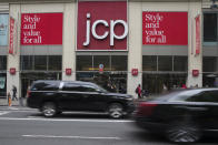 FILE - In this May 16, 2018, file photo, traffic makes its way past a logo J.C. Penney store outside the Manhattan mall in New York. J.C. Penney Co. reports financial results Thursday, Aug. 15..(AP Photo/Mary Altaffer, File)