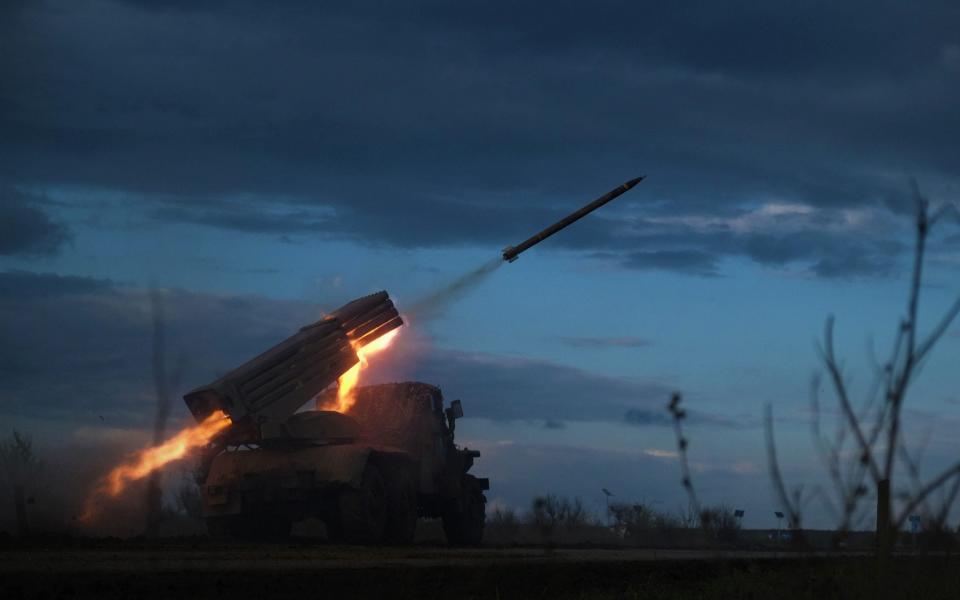 A BM-21 Grad multiple rocket launcher fires towards Russian positions on the frontline near Bakhmut, Donetsk - SERGEY SHESTAK/AFP