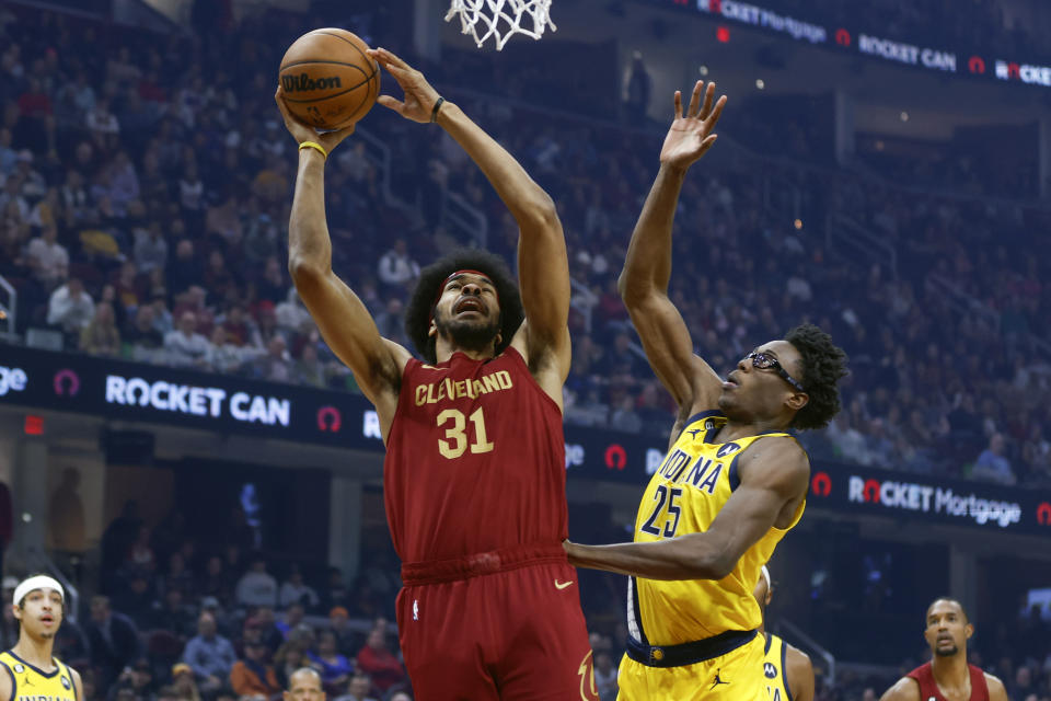 Cleveland Cavaliers center Jarrett Allen (31) shoots against Indiana Pacers forward Jalen Smith (25) during the first half of an NBA basketball game, Friday, Dec. 16, 2022, in Cleveland. (AP Photo/Ron Schwane)