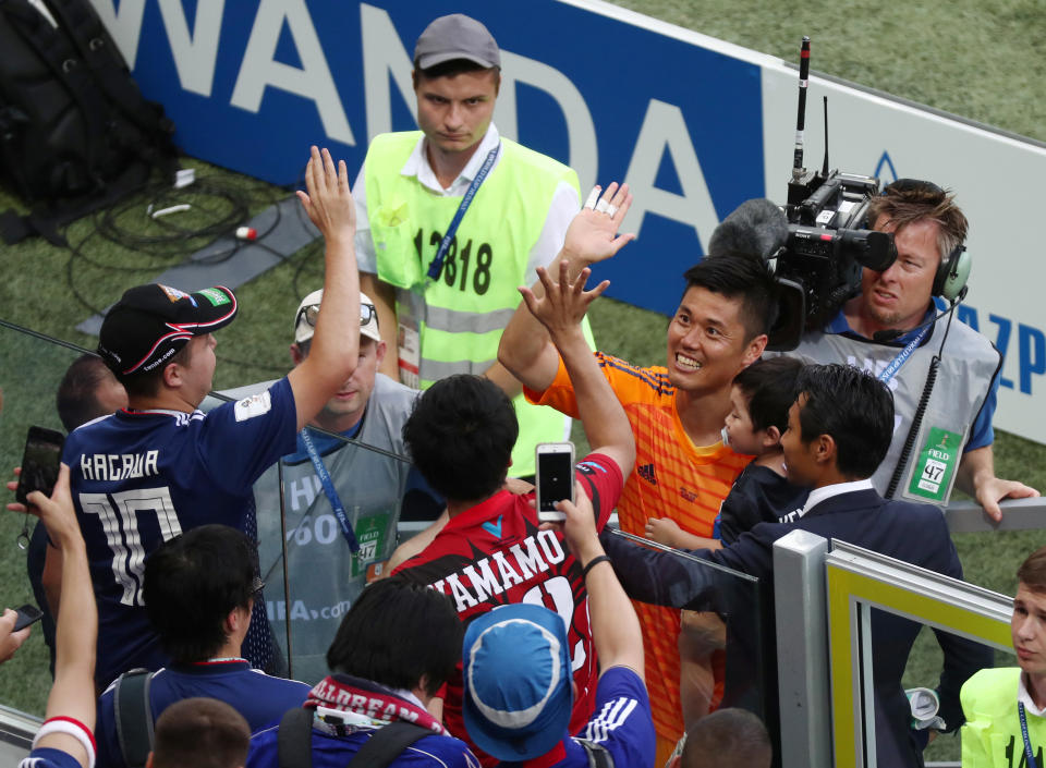 <p>Japan’s Eiji Kawashima celebrates after the match with fans REUTERS/Sergio Perez </p>