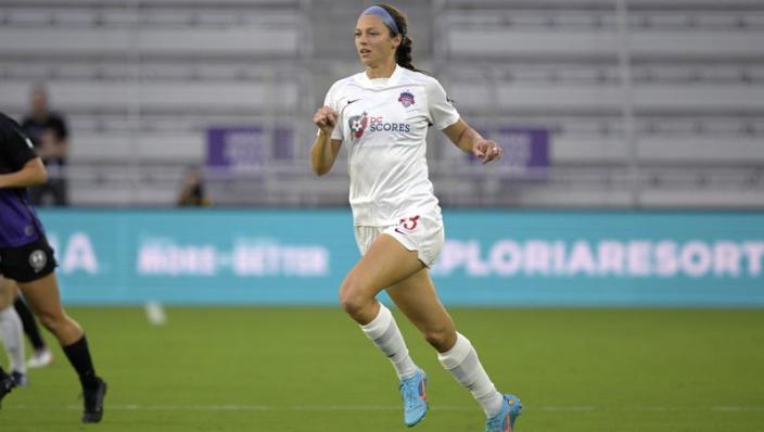 Washington Spirit forward Ashley Hatch (33) follows a ball during an NWSL Challenge Cup soccer match against the Orlando Pride, Saturday, March 19, 2022, in Orlando, Fla. (AP Photo/Phelan M. Ebenhack)