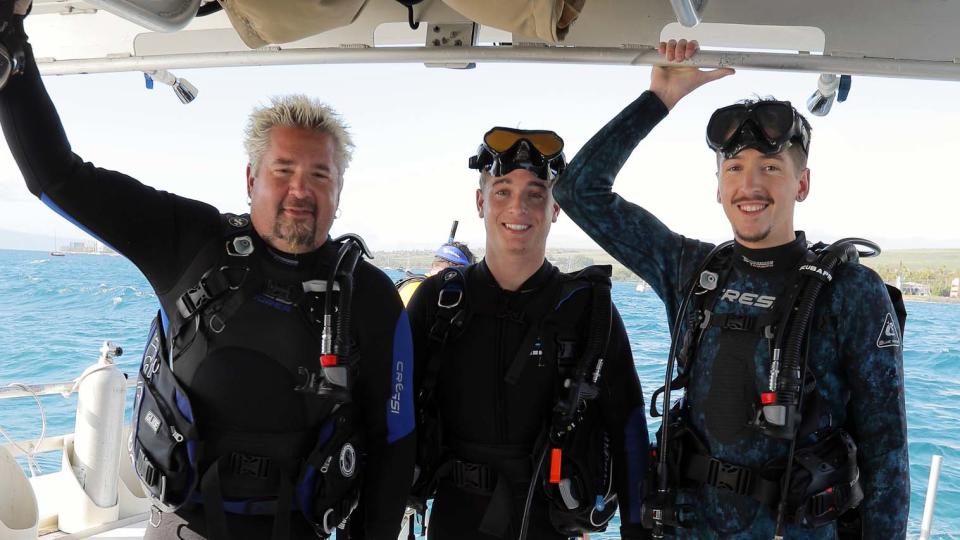 Fieri and his sons pose on the Lahaina Divers boat en route to a reef in Lahaina, Hawaii, as seen on his new Discovery+ series "Guy: Hawaiian Style."