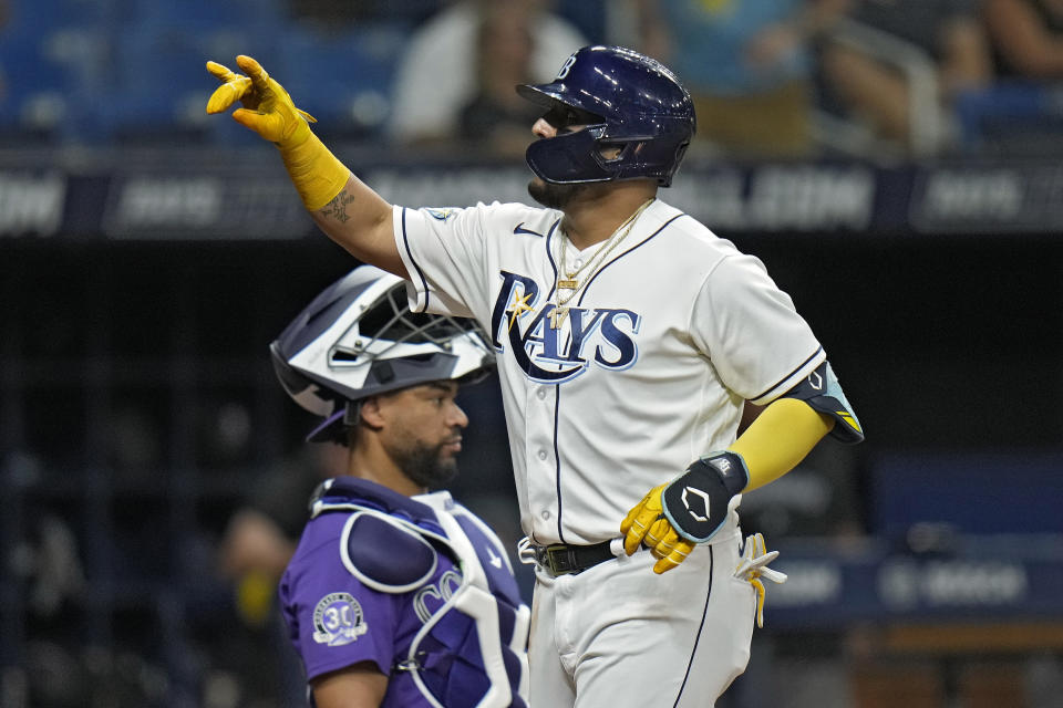 Tampa Bay Rays' Isaac Paredes celebrates his home run of Colorado Rockies starting pitcher Austin Gomber during the sixth inning of a baseball game Wednesday, Aug. 23, 2023, in St. Petersburg, Fla. Catching for the Rockies is Elias Diaz. (AP Photo/Chris O'Meara)