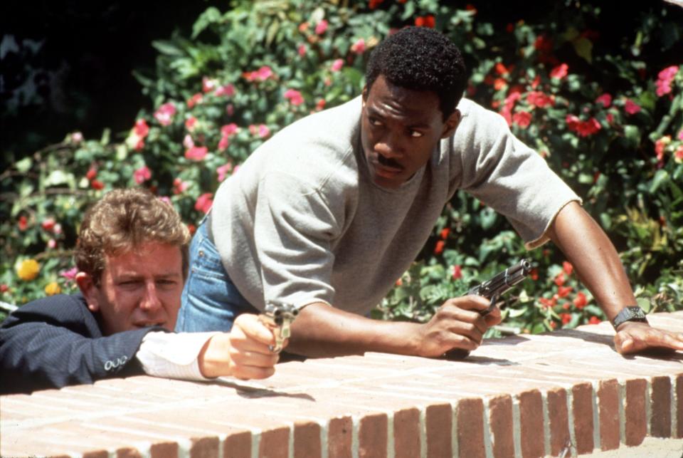 Judge Reinhold, left, and Eddie Murphy in 1984's "Beverly Hills Cop." The duo and other cast members return for the fourth installment, Netflix's "Beverly Hills Cop: Axel F."