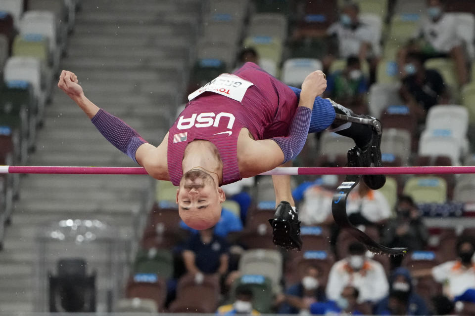 Sam Grewe of the United States competes in the men's high jump T63 final during the Tokyo 2020 Paralympics Games at the National Stadium in Tokyo, Japan, Tuesday, Aug. 31, 2021. (AP Photo/Eugene Hoshiko)