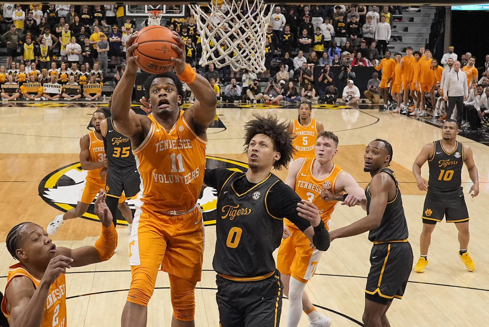 Tennessee forward Tobe Awaka (11) beats Missouri forward Jordan Butler (0) to a rebound during the first half of an NCAA college basketball game against Missouri Tuesday, Feb. 20, 2024, in Columbia, Mo. (AP Photo/Charlie Riedel)