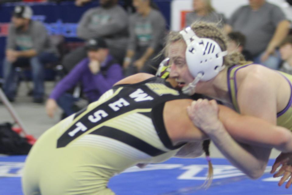 Cut Bank's Mariah Wahl, defending girls' 138-pound champion, looks to her coach for guidance as she battles Makenzee Neal of Billings West in the finals of the All-Class State Wrestling Tournament Saturday, Feb. 12, 2022 at MetraPark in Billings. Wahl defended her title with a 2-0 decision.