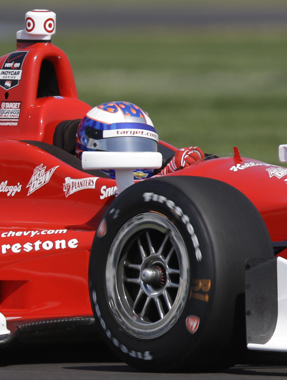 Scott Dixon, of New Zealand, drives through turn 13 during practice for the inaugural Grand Prix of Indianapolis IndyCar auto race at the Indianapolis Motor Speedway in Indianapolis, Thursday, May 8, 2014. (AP Photo/Michael Conroy)