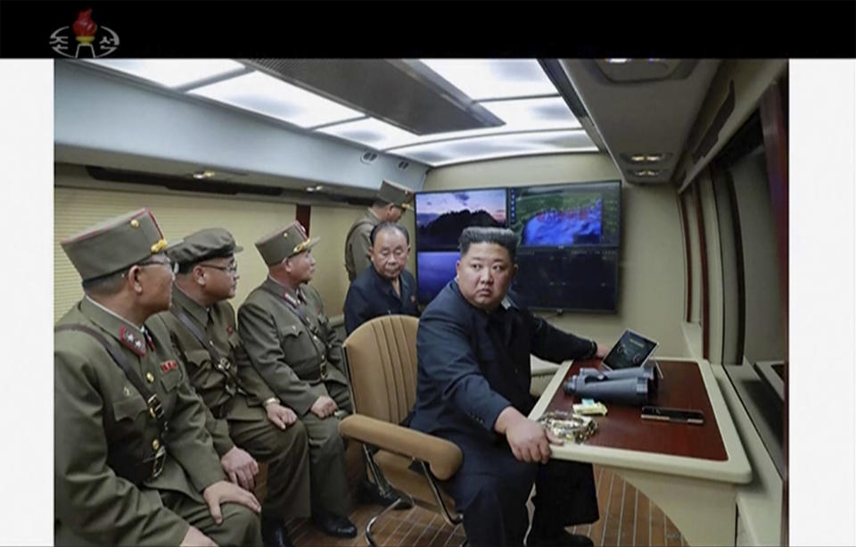 In this image made from video of a still image broadcasted by North Korea's KRT on Thursday, Aug. 1, 2019, North Korean leader Kim Jong Un supervises a rocket launch test . North Korea said Thursday, Aug. 1, leader Kim supervised the first test firing of a new multiple rocket launcher system that could potentially enhance its ability to strike targets in South Korea and U.S. military bases there.(KRT via AP Video)