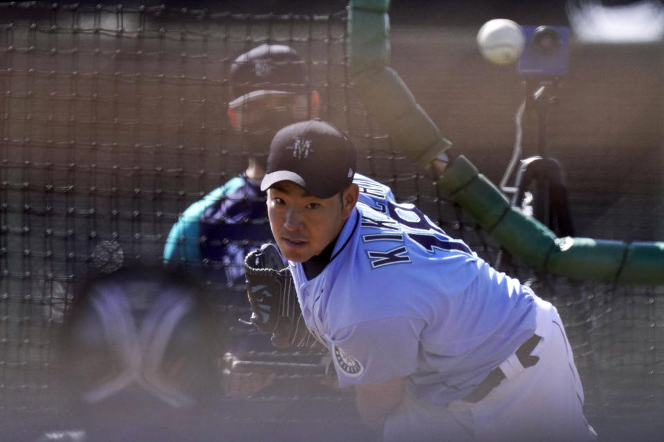 Seattle Mariners pitcher Yusei Kikuchi throws during baseball spring training Thursday, Feb. 25, 2021, in Peoria, Ariz. (AP Photo/Charlie Riedel)