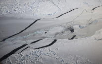 <p>Ice floats near the coast of West Antarctica as seen from a window of a NASA Operation IceBridge airplane during a mission to observe sea ice on Oct. 27, 2016 in-flight over Antarctica. NASA’s Operation IceBridge has been studying how polar ice has evolved over the past eight years and is currently flying a set of 12-hour research flights over West Antarctica at the start of the melt season. Researchers have used the IceBridge data to observe that the West Antarctic Ice Sheet may be in a state of irreversible decline directly contributing to rising sea levels. NASA and University of California, Irvine (UCI) researchers have recently detected the speediest ongoing Western Antarctica glacial retreat rates ever observed. (Photo: Mario Tama/Getty Images) </p>