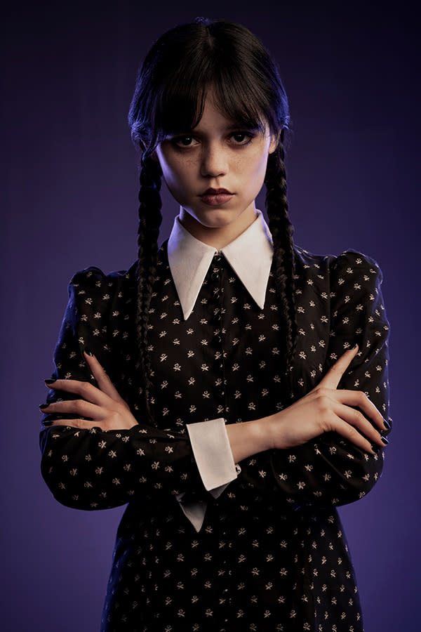 full body of a Wednesday Addams (Jenna Ortega) grinds the big axe