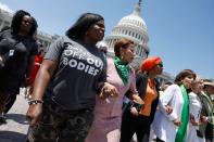 Rep. Cori Bush (D-MO) (2nd L), Rep. Nydia Velazquez (D-NY), Rep. Ilhan Omar (D-MN), Rep. Jackie Speier (D-CA), and Rep. Carolyn Maloney (D-NY), walk from the U.S. Capitol Building to join a protest with activists from the Center for Popular Democracy Action (CPDA) on July 19, 2022 in Washington, DC.