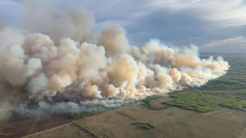 Smoke rises Friday from mutual aid wildfire GCU007 in the Grande Prairie Forest Area near TeePee Creek, Alberta. - Alberta Wildfire/Handout/Reuters