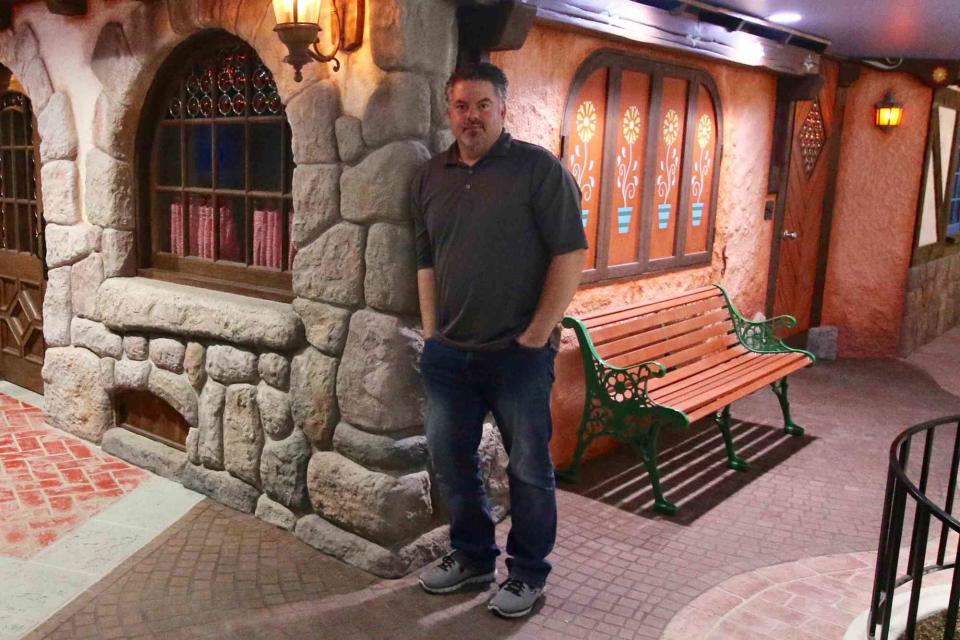 <p>courtesy of Travis Larson</p> Travis Larson in his Disney-inspired basement in Utah