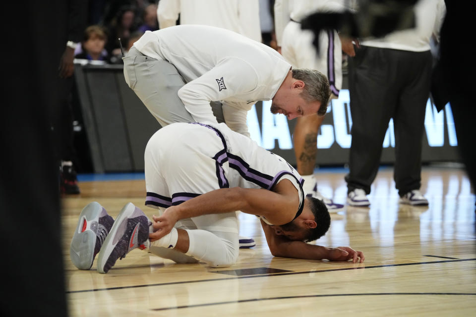 Kansas State guard Markquis Nowell (1) holds his ankle after a play in the second half of a Sweet 16 college basketball game against Michigan State in the East Regional of the NCAA tournament at Madison Square Garden, Thursday, March 23, 2023, in New York. (AP Photo/Frank Franklin II)