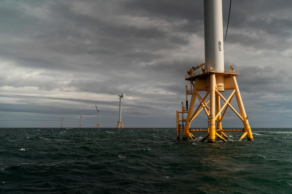 The five turbines of America's first offshore wind farm stand off the coast of Block Island, Rhode Island, as seen in October 2022. Duke Energy has sold its commercial renewables business, but says it remains committed to offshore wind projects.