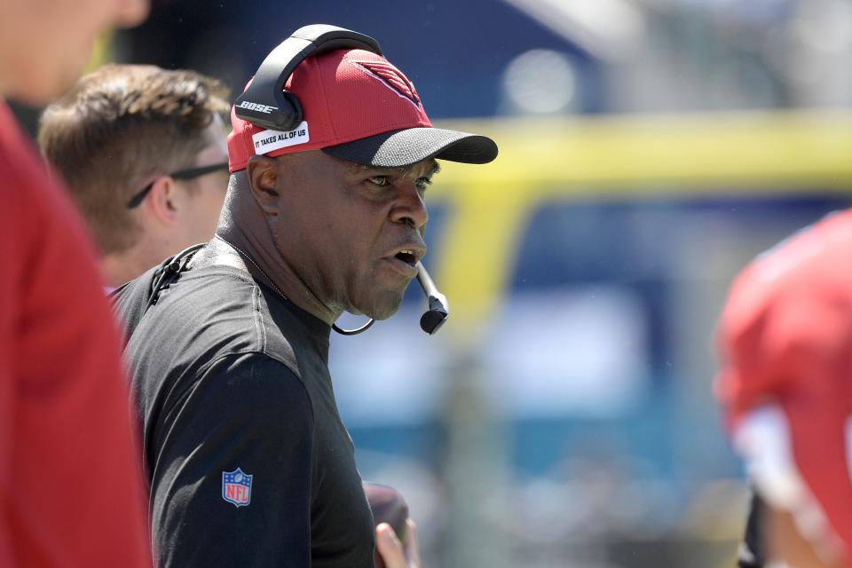 Arizona Cardinals running backs coach James Saxon works on the sideline during the first half of an NFL football game against the Jacksonville Jaguars, Sunday, Sept. 26, 2021, in Jacksonville, Fla.