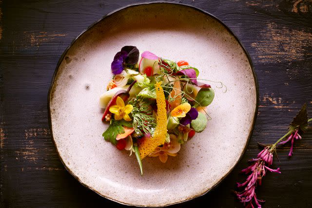 <p>Dan Goldberg Photography/Courtesy of The Resort at Paws Up</p> A spring salad at the 23-seat Social Haus restaurant.