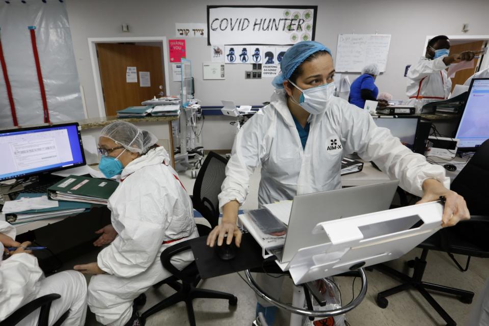 Flor Treviño, center, works in the COVID unit at Houston's United Memorial Medical Center