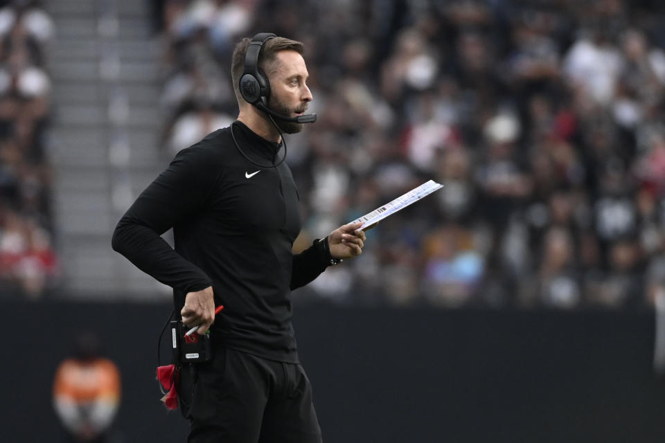 Arizona Cardinals head coach Kliff Kingsbury watches from the sideline during the second half of an NFL football game against the Las Vegas Raiders Sunday, Sept. 18, 2022, in Las Vegas. (AP Photo/David Becker)